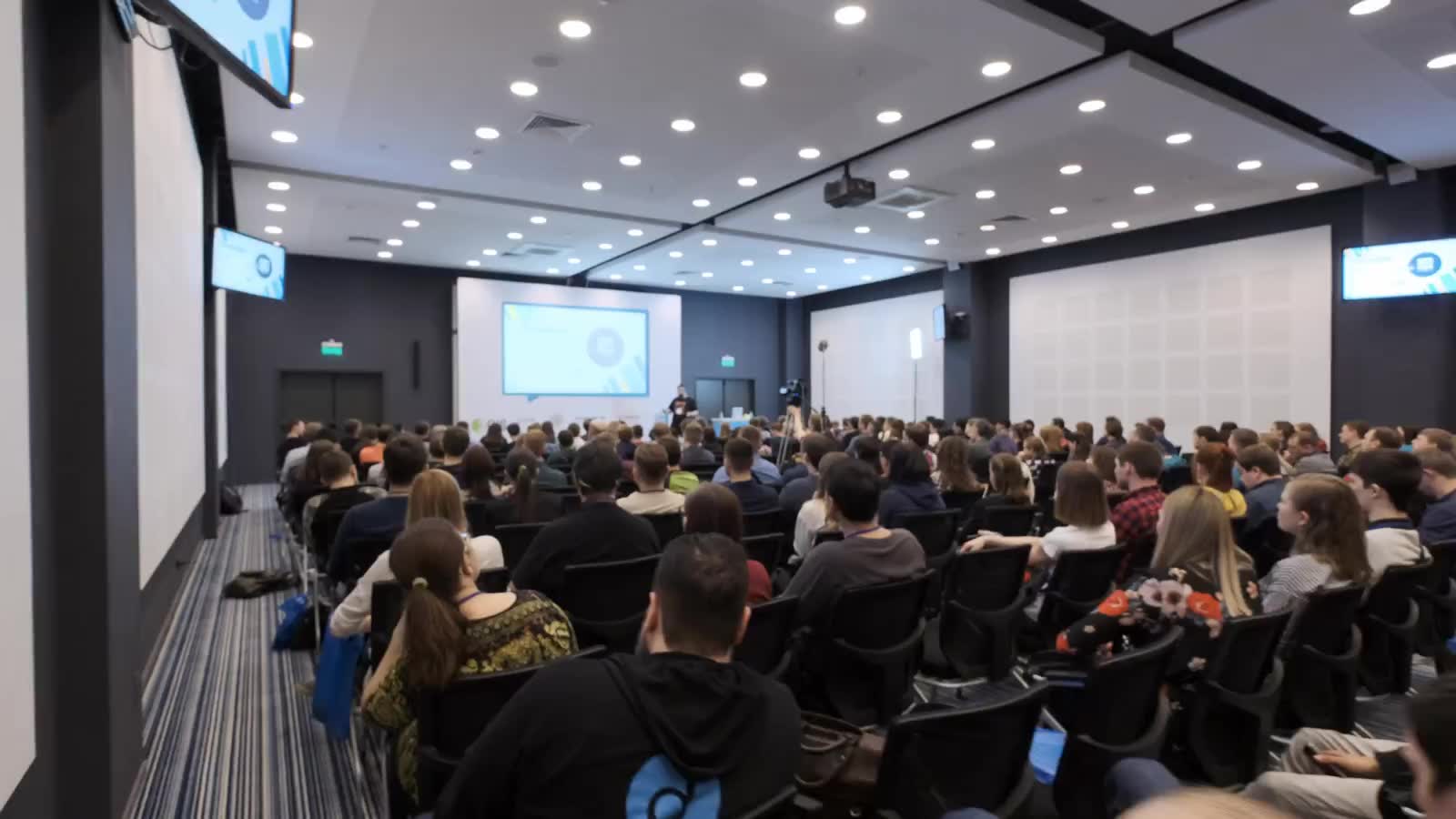A large conference session in progress